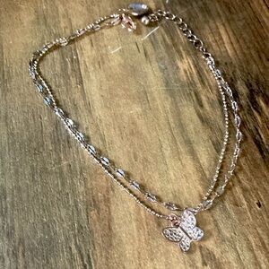 Clasp, butterfly charm ankle bracelet, gold.